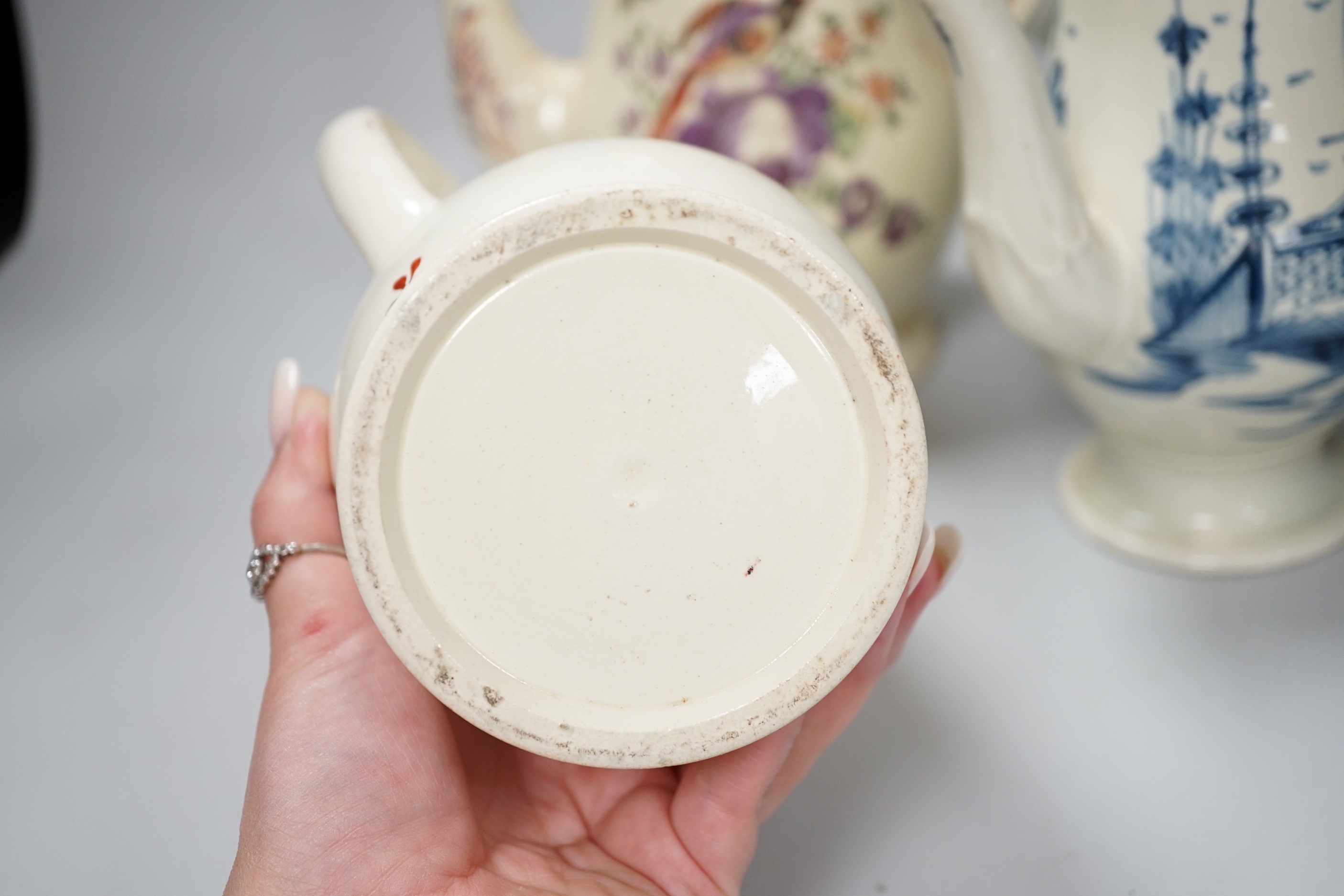 Three Georgian creamware and pearlware teapots, a jug and a mug, tallest 27cm